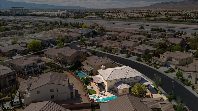 bird's eye view with a residential view and a mountain view
