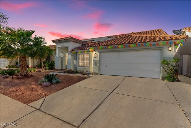 7874 Trail Boss Ct, Las Vegas, NV 89113 - mediterranean / spanish house featuring driveway, roof mounted solar panels, a garage, a tile roof, and stucco siding