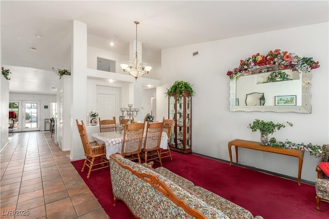 7874 Trail Boss Ct, Las Vegas, NV 89113 - tiled dining area featuring a chandelier and baseboards