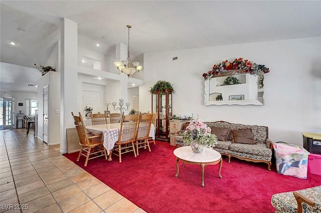 7874 Trail Boss Ct, Las Vegas, NV 89113 - tiled living room with a chandelier, lofted ceiling, and recessed lighting