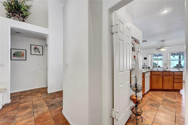 7874 Trail Boss Ct, Las Vegas, NV 89113 - hallway with recessed lighting, baseboards, and a sink