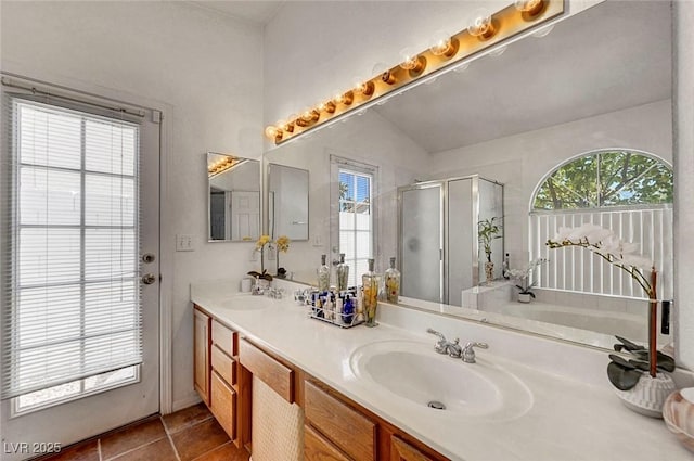 7874 Trail Boss Ct, Las Vegas, NV 89113 - full bathroom featuring plenty of natural light, a shower stall, double vanity, and tile patterned flooring