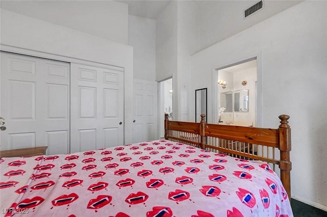 7874 Trail Boss Ct, Las Vegas, NV 89113 - bedroom with a closet, carpet, baseboards, ensuite bathroom, and a high ceiling