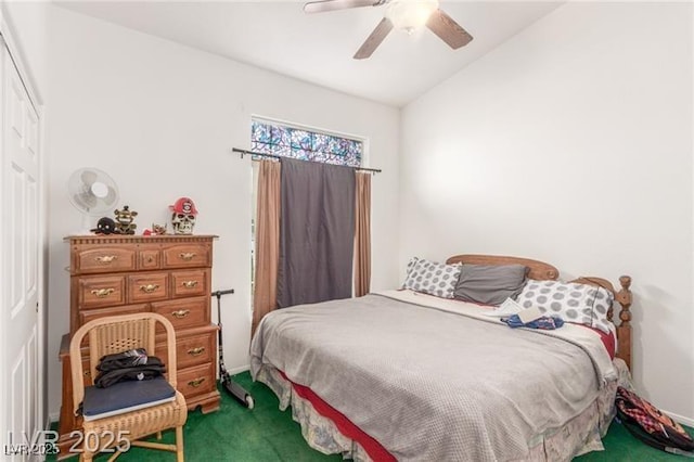 7874 Trail Boss Ct, Las Vegas, NV 89113 - bedroom with carpet, a ceiling fan, vaulted ceiling, and a closet