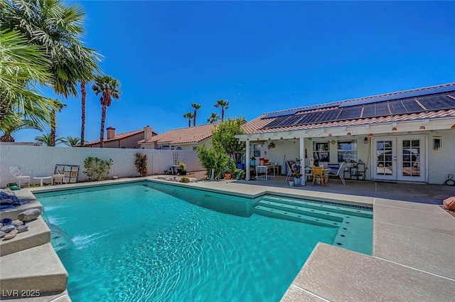 7874 Trail Boss Ct, Las Vegas, NV 89113 - view of pool with french doors, a patio, and a fenced backyard