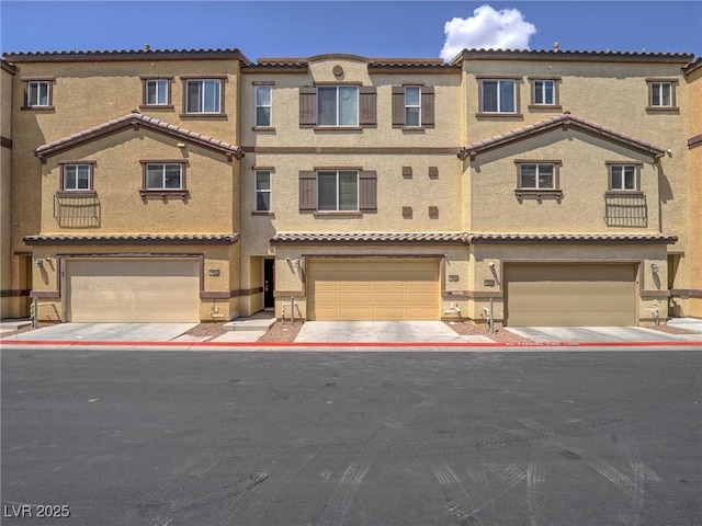1525 Spiced Wine Ave Unit 19103, Henderson, NV 89074 - townhome / multi-family property featuring an attached garage and stucco siding