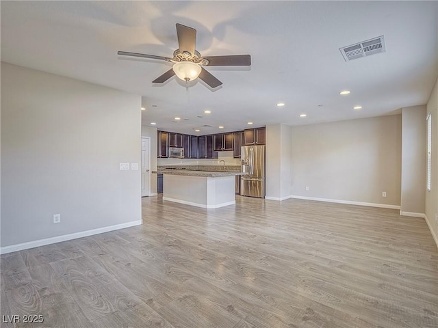 1525 Spiced Wine Ave Unit 19103, Henderson, NV 89074 - unfurnished living room featuring visible vents, baseboards, recessed lighting, a ceiling fan, and light wood-style flooring