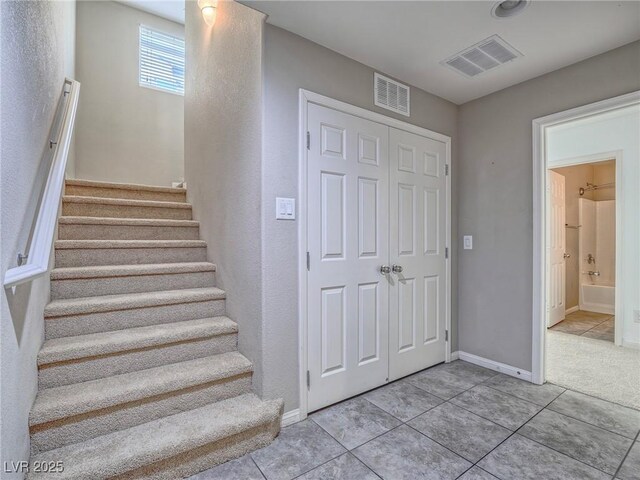 1525 Spiced Wine Ave Unit 19103, Henderson, NV 89074 - stairs featuring baseboards, tile patterned flooring, and visible vents