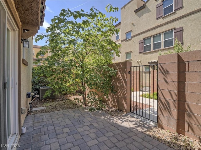 1525 Spiced Wine Ave Unit 19103, Henderson, NV 89074 - view of patio with central air condition unit, fence, and a gate