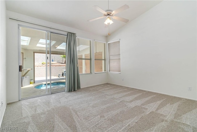 spare room featuring baseboards, carpet flooring, ceiling fan, and lofted ceiling