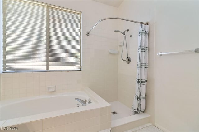 full bath featuring a garden tub and a shower stall