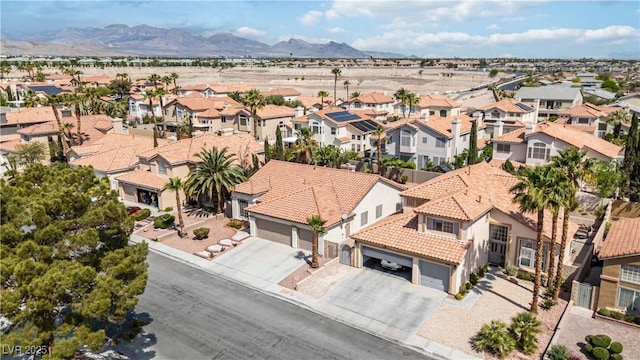 birds eye view of property with a residential view and a mountain view