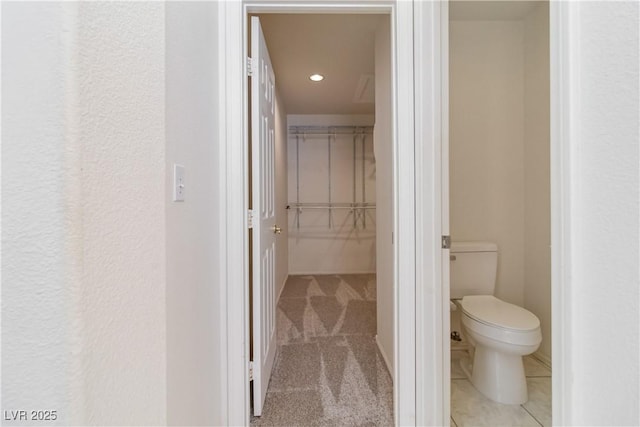 bathroom featuring toilet and recessed lighting