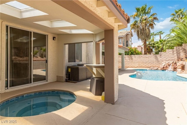 view of pool featuring a fenced in pool, an in ground hot tub, a patio area, and fence