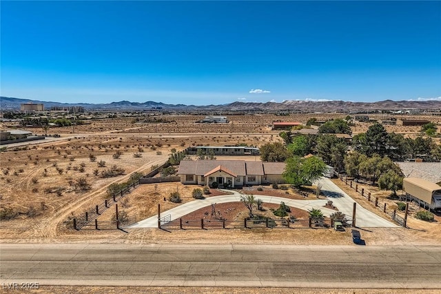 drone / aerial view featuring a mountain view and a rural view