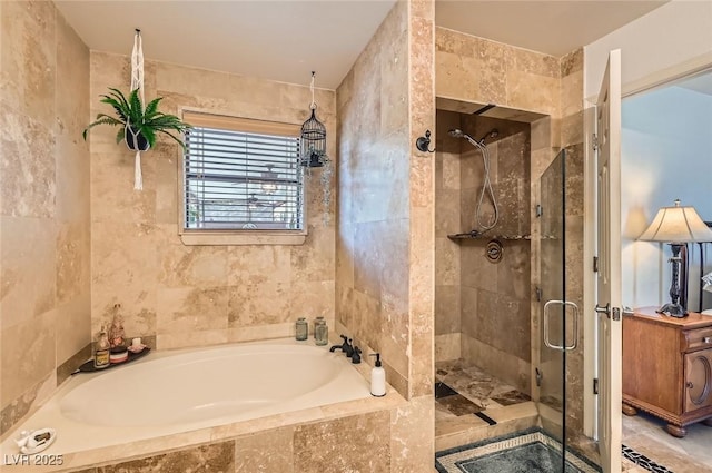 bathroom featuring a bath and a shower stall