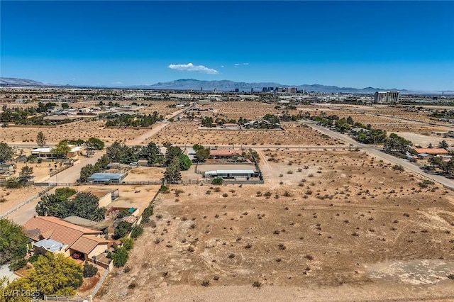 bird's eye view with a rural view, a mountain view, and view of desert