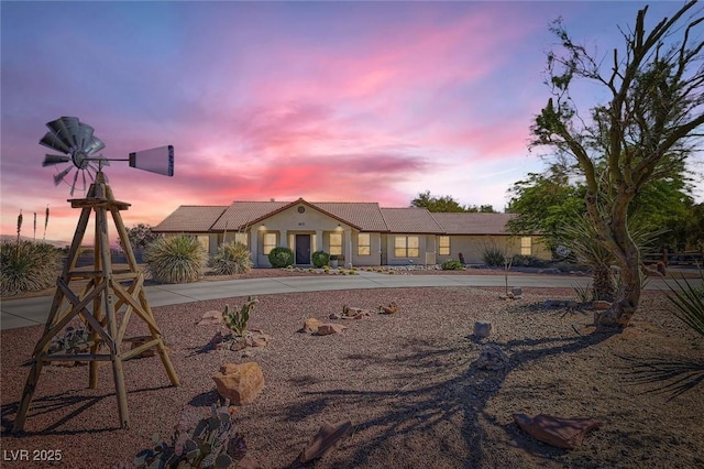 ranch-style home with stucco siding