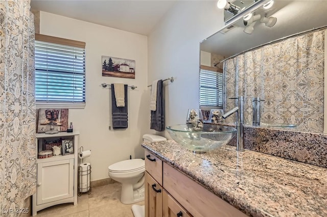 full bathroom with toilet, a shower with shower curtain, tile patterned flooring, and vanity