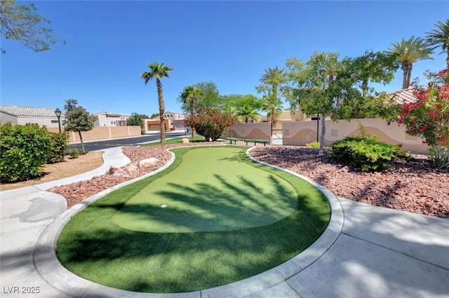 view of home's community with fence and a residential view