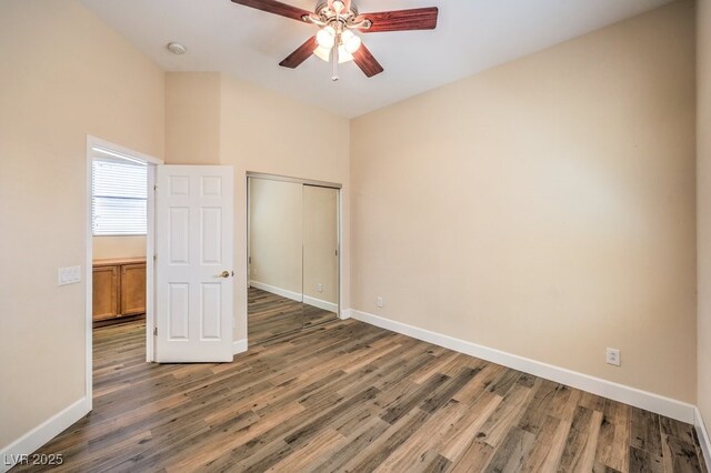 35 Glade Water Dr, Henderson, NV 89052 - unfurnished bedroom with baseboards, wood finished floors, a closet, and ceiling fan