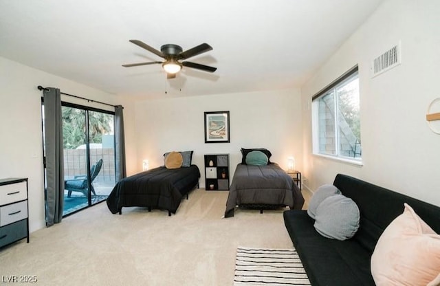3789 Heritage Ave, Las Vegas, NV 89121 - bedroom featuring light colored carpet, access to exterior, and a ceiling fan