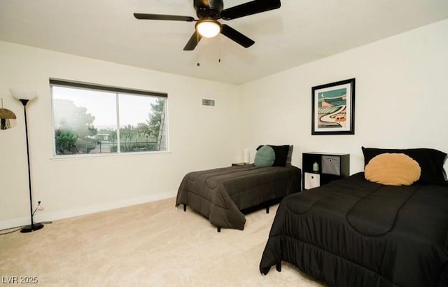 3789 Heritage Ave, Las Vegas, NV 89121 - bedroom with light colored carpet, baseboards, and a ceiling fan