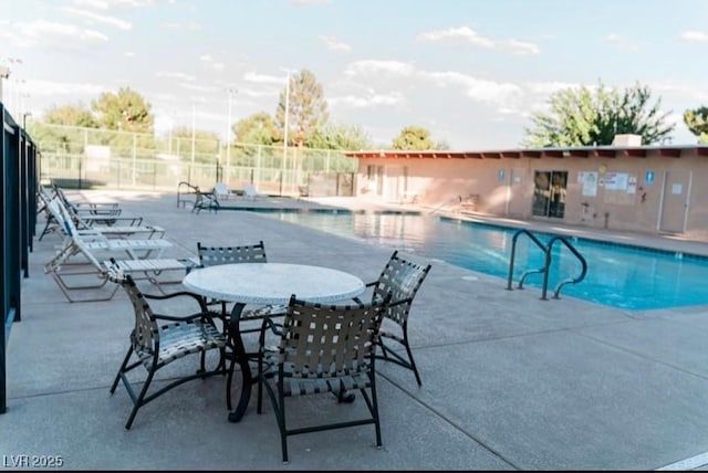 3789 Heritage Ave, Las Vegas, NV 89121 - community pool featuring fence and a patio