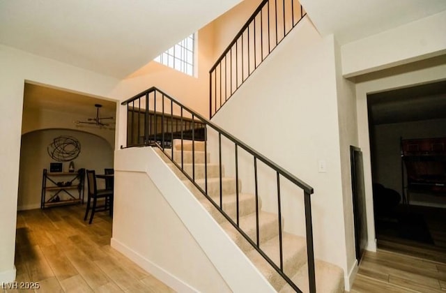 3789 Heritage Ave, Las Vegas, NV 89121 - stairway featuring wood finished floors and baseboards