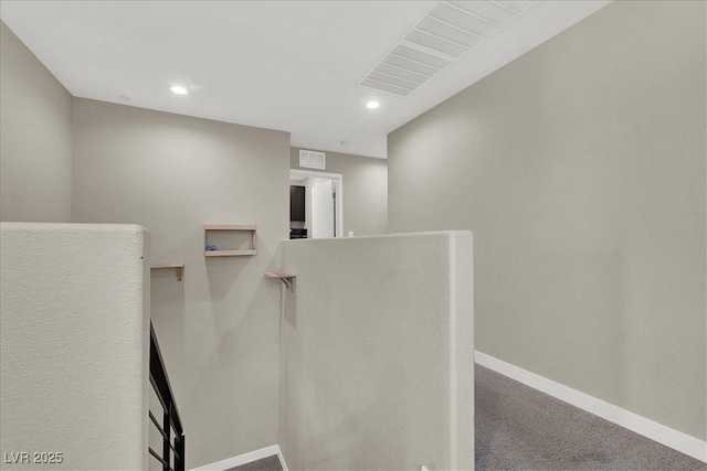 interior space featuring recessed lighting, baseboards, visible vents, and carpet