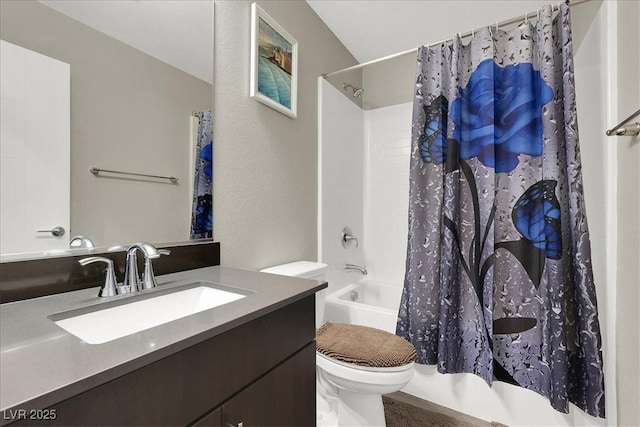 full bath featuring vanity, toilet, and shower / tub combo