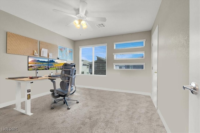 office area featuring ceiling fan, visible vents, baseboards, and carpet