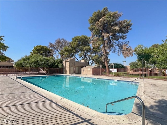 pool featuring a patio and fence