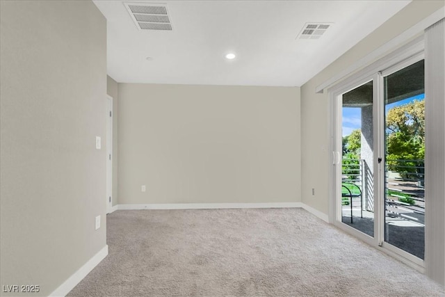 spare room featuring visible vents, recessed lighting, carpet, and baseboards