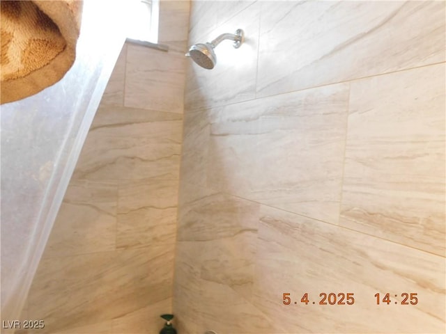 details featuring a tile shower