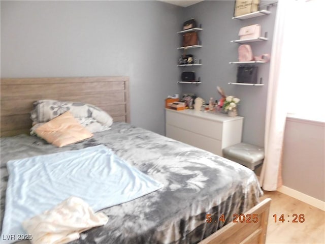 bedroom with light wood-type flooring