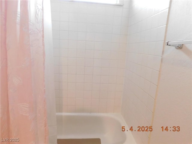 bathroom featuring shower / bath combo with shower curtain