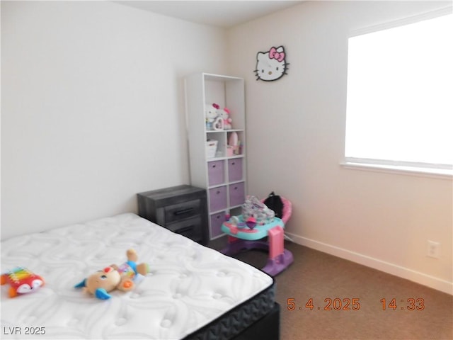 bedroom featuring baseboards