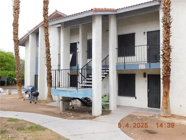 view of property featuring stairway