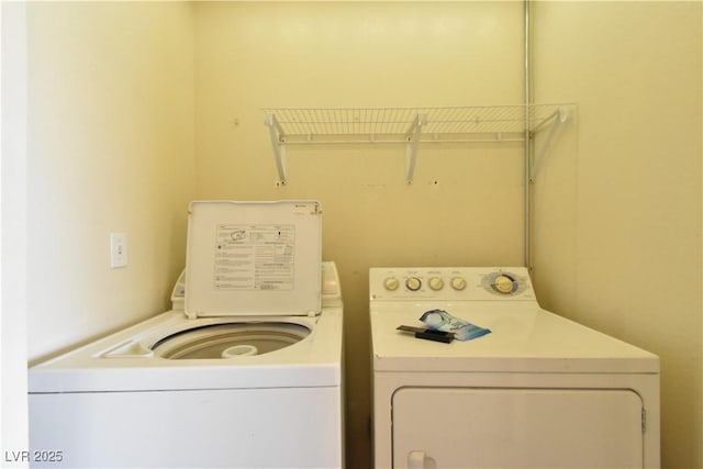 washroom with washing machine and dryer