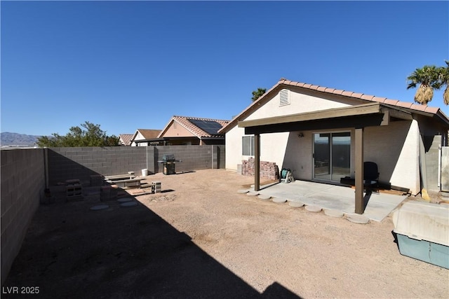exterior space with a patio and a fenced backyard