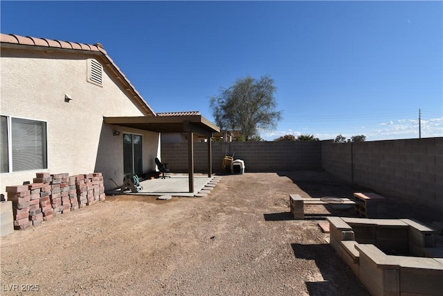 view of yard featuring a fenced backyard and a patio