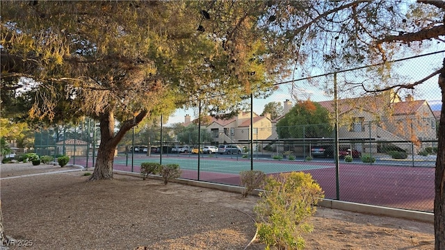 view of sport court with fence