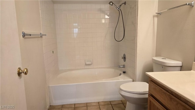 bathroom featuring toilet, tile patterned floors, tub / shower combination, and vanity
