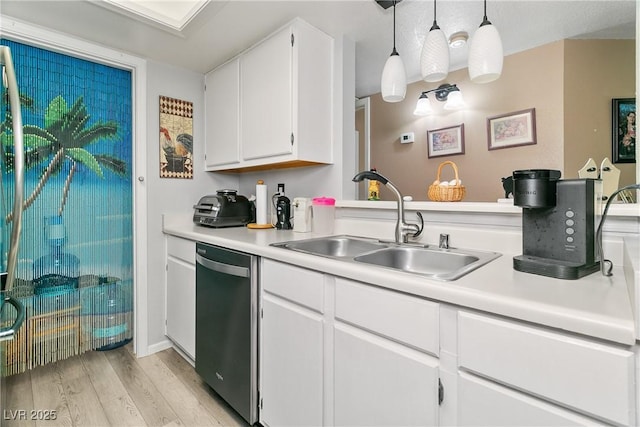 kitchen with a sink, light countertops, stainless steel dishwasher, and light wood-style flooring