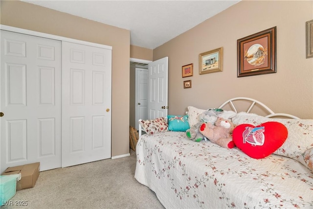 bedroom with carpet floors and a closet