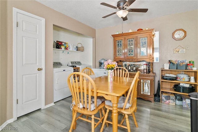 dining room featuring ceiling fan, light wood finished floors, and independent washer and dryer