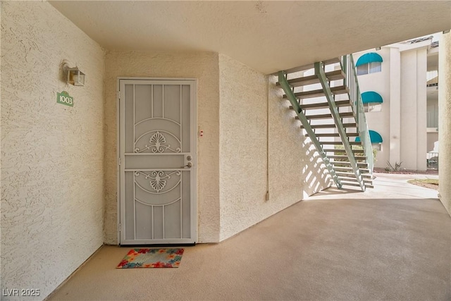 property entrance featuring stucco siding