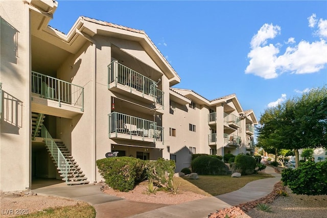view of property featuring stairway