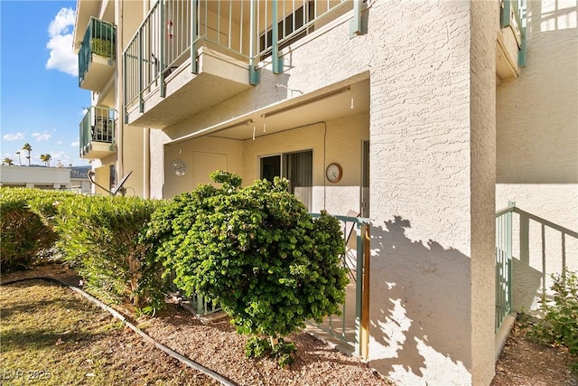 doorway to property with stucco siding